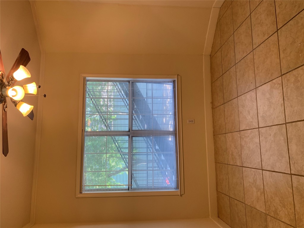 2100 San Gabriel Street, Unit 103 Austin, TX 78705 - Photo 18 of 20 a view of a livingroom with an empty space and a window