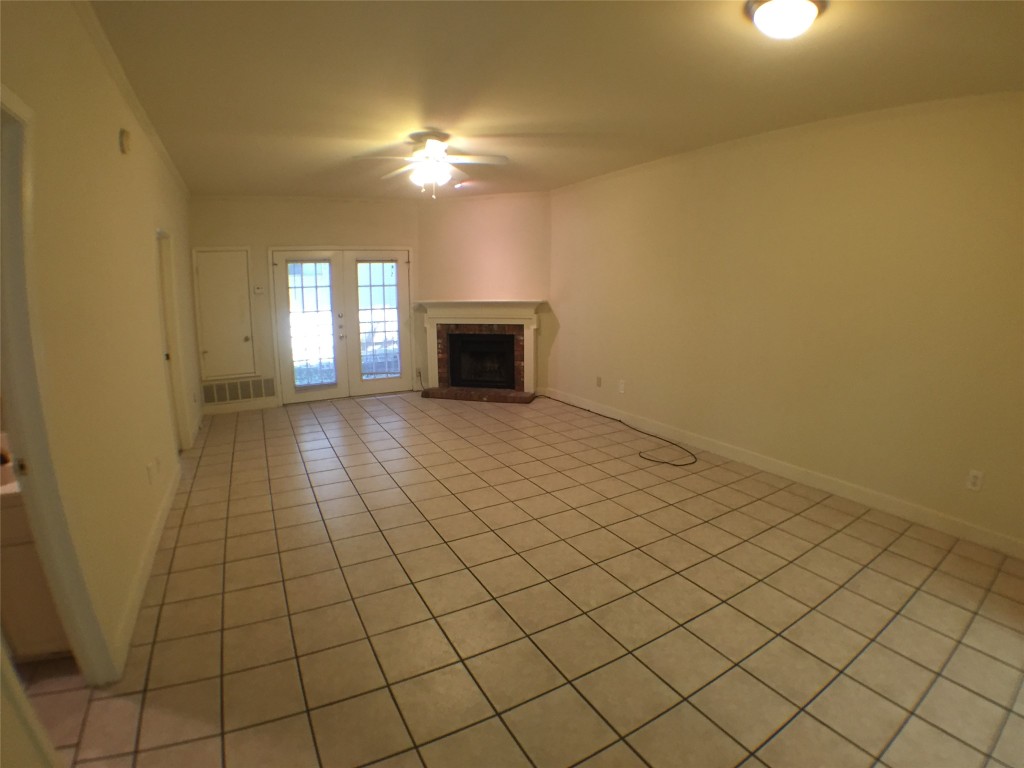 2100 San Gabriel Street, Unit 103 Austin, TX 78705 - Photo 2 of 20 a view of an empty room and window