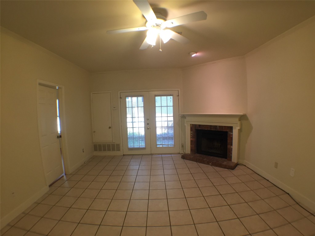 2100 San Gabriel Street, Unit 103 Austin, TX 78705 - Photo 3 of 20 a view of an empty room window and fire place