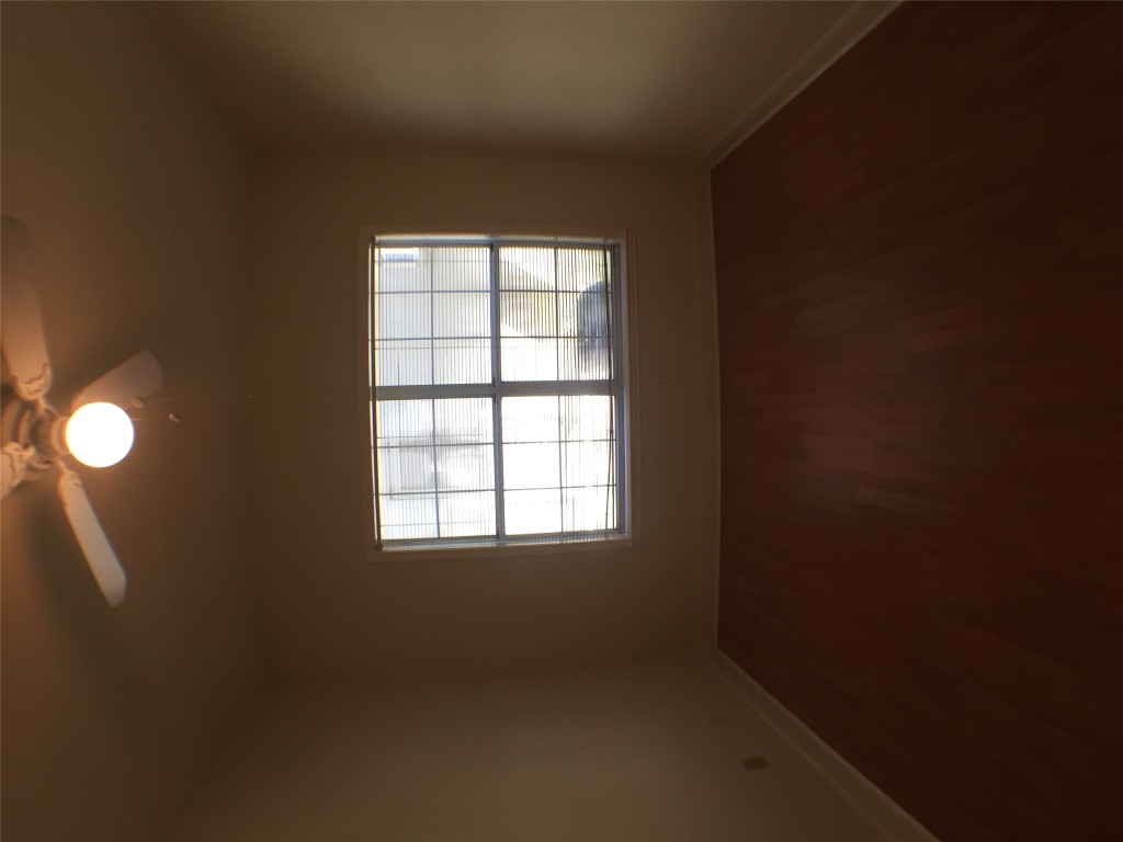 2100 San Gabriel Street, Unit 103 Austin, TX 78705 - Photo 8 of 20 an empty room with a window