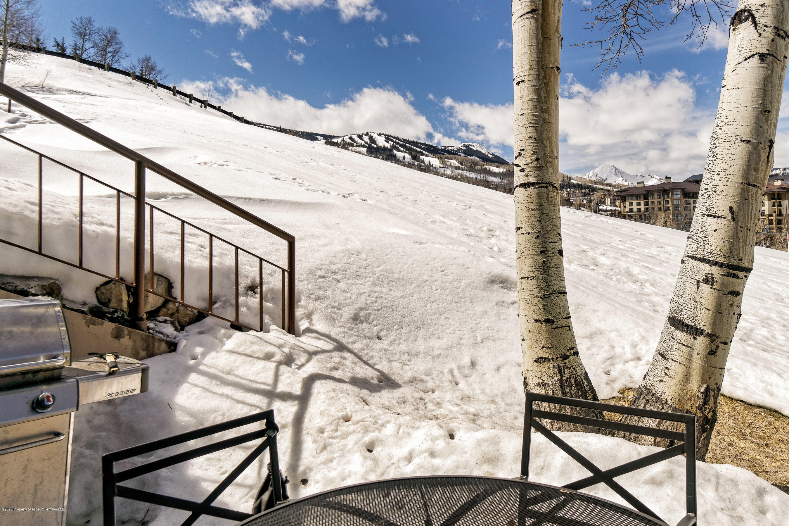 810 Ridge Road, Unit 6 Snowmass Village, CO 81615 - Photo 20 of 33 a view of an chairs and table in the patio