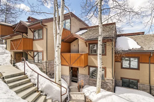 a bathroom with a granite countertop shower and a curtain