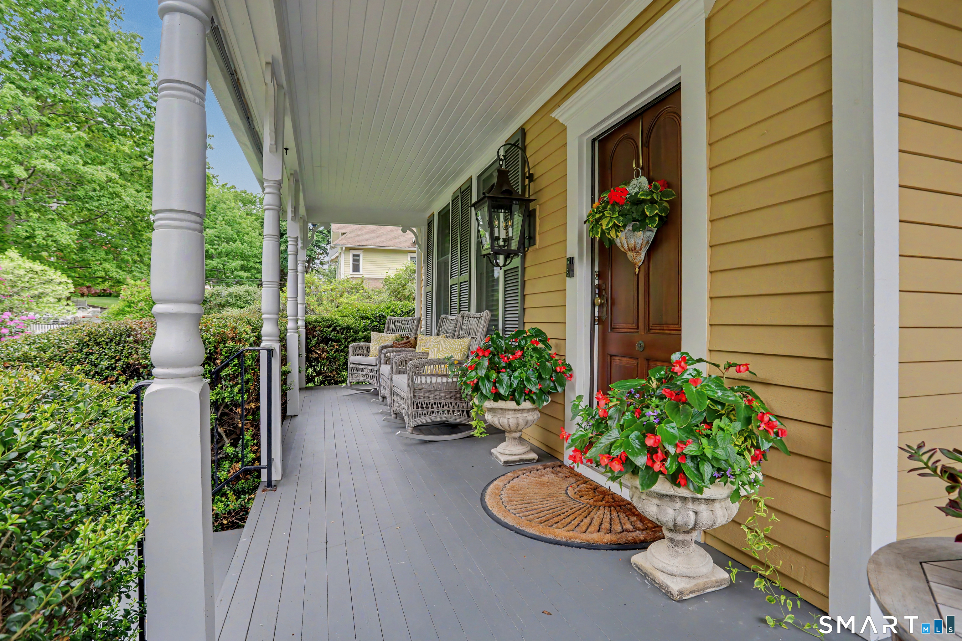 36 Catoonah Street, Unit 18 Ridgefield, CT 06877 - Photo 2 of 40 a view of a porch filled with furniture