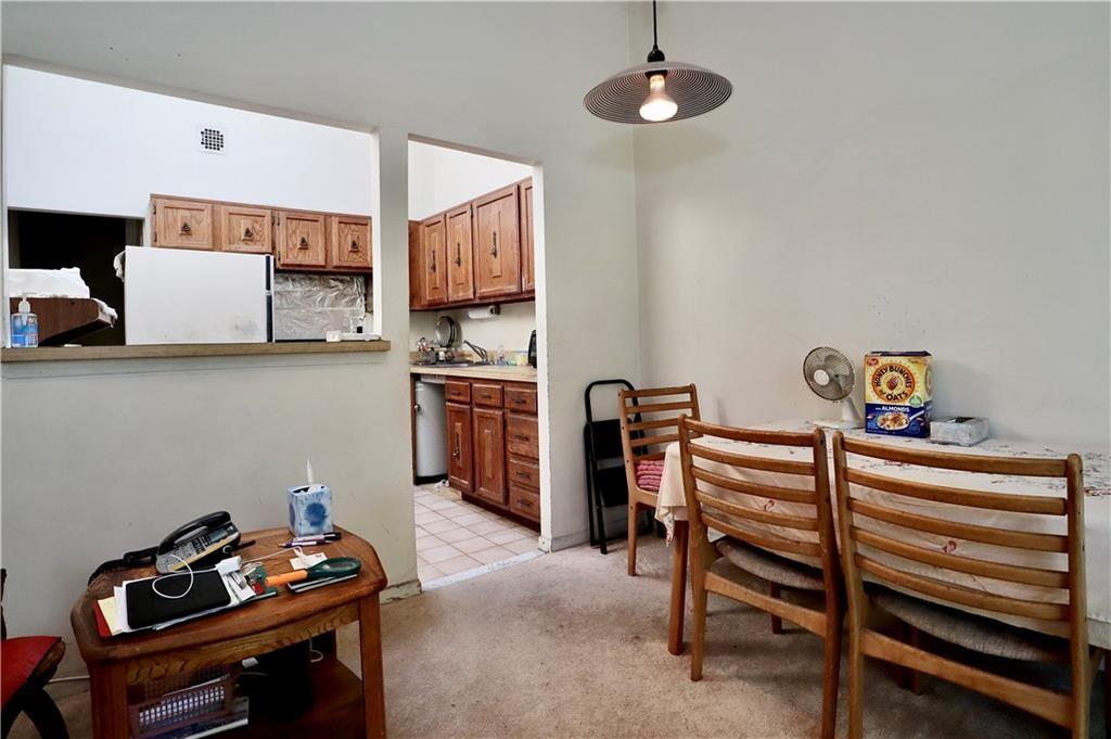 9967 Shore Road, Unit 7E Brooklyn, NY 11209 - Photo 16 of 19 a living room with furniture and a flat screen tv