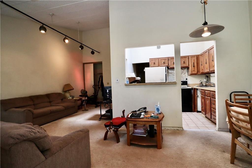 9967 Shore Road, Unit 7E Brooklyn, NY 11209 - Photo 18 of 19 a living room with furniture and a kitchen