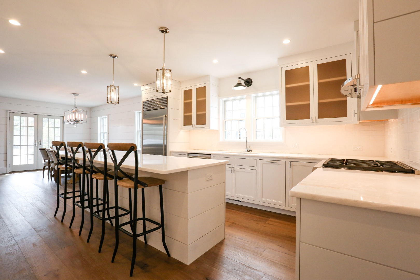 3 Blazing Star Road Nantucket, MA 02554 - Photo 9 of 38 a kitchen with a table chairs sink and cabinets