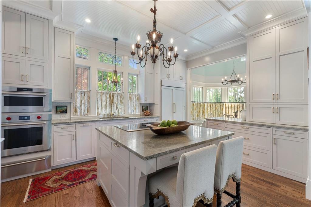 2519 Forrest Way Northeast Atlanta, GA 30305 - Photo 14 of 36 a kitchen that has a sink a stove and a wooden floor
