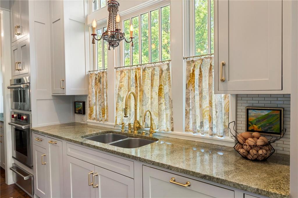 2519 Forrest Way Northeast Atlanta, GA 30305 - Photo 18 of 36 a kitchen with a sink and a window