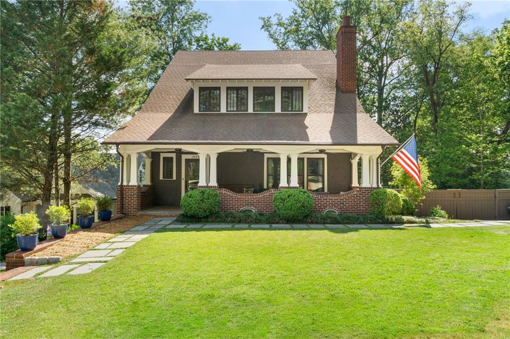 2519 Forrest Way Northeast Atlanta, GA 30305 - Photo 2 of 36 a front view of a house with a yard and trees