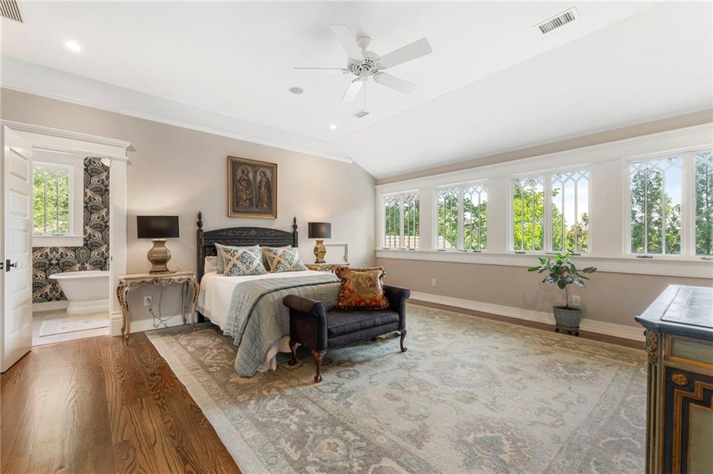 2519 Forrest Way Northeast Atlanta, GA 30305 - Photo 22 of 36 a spacious bedroom with a large bed and a large window