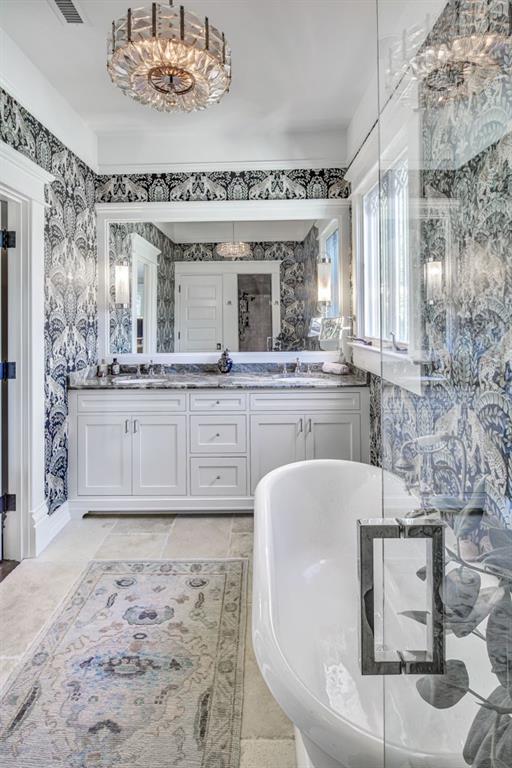 2519 Forrest Way Northeast Atlanta, GA 30305 - Photo 24 of 36 a spacious bathroom with a granite countertop sink a mirror and bathtub