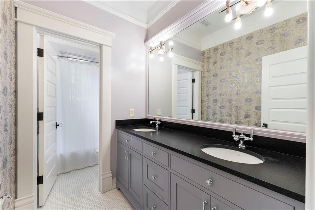 2519 Forrest Way Northeast Atlanta, GA 30305 - Photo 26 of 36 a bathroom with a sink and a mirror