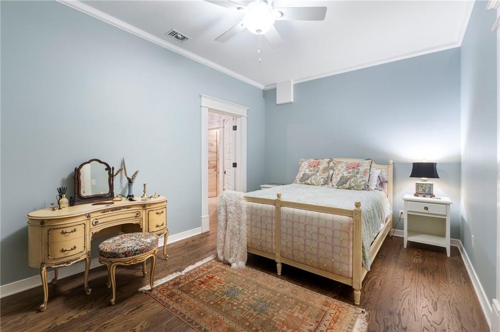 2519 Forrest Way Northeast Atlanta, GA 30305 - Photo 29 of 36 a bedroom with a bed and a chandelier