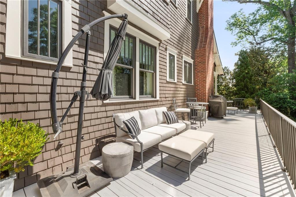 2519 Forrest Way Northeast Atlanta, GA 30305 - Photo 33 of 36 a view of a patio with couches table and chairs and potted plants