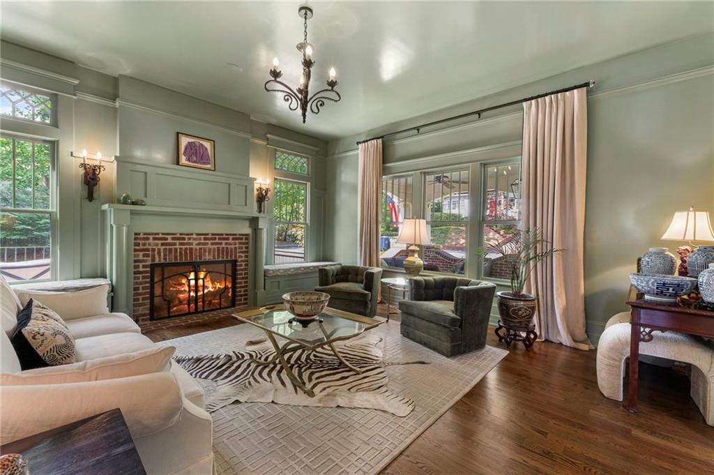 2519 Forrest Way Northeast Atlanta, GA 30305 - Photo 7 of 36 a living room with furniture a fireplace and a large window