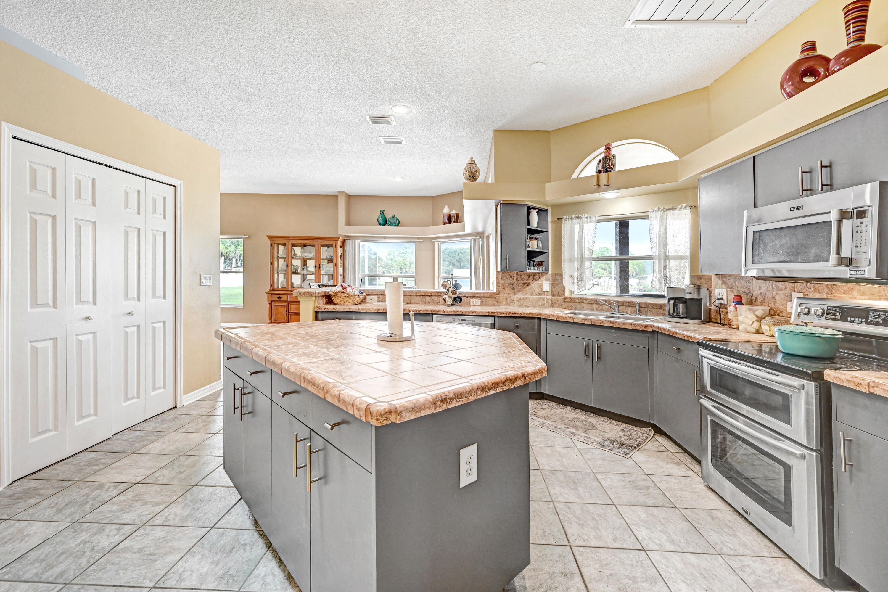 4600 James Road Cocoa, FL 32926 - Photo 20 of 56 a kitchen with stainless steel appliances granite countertop a sink and cabinets