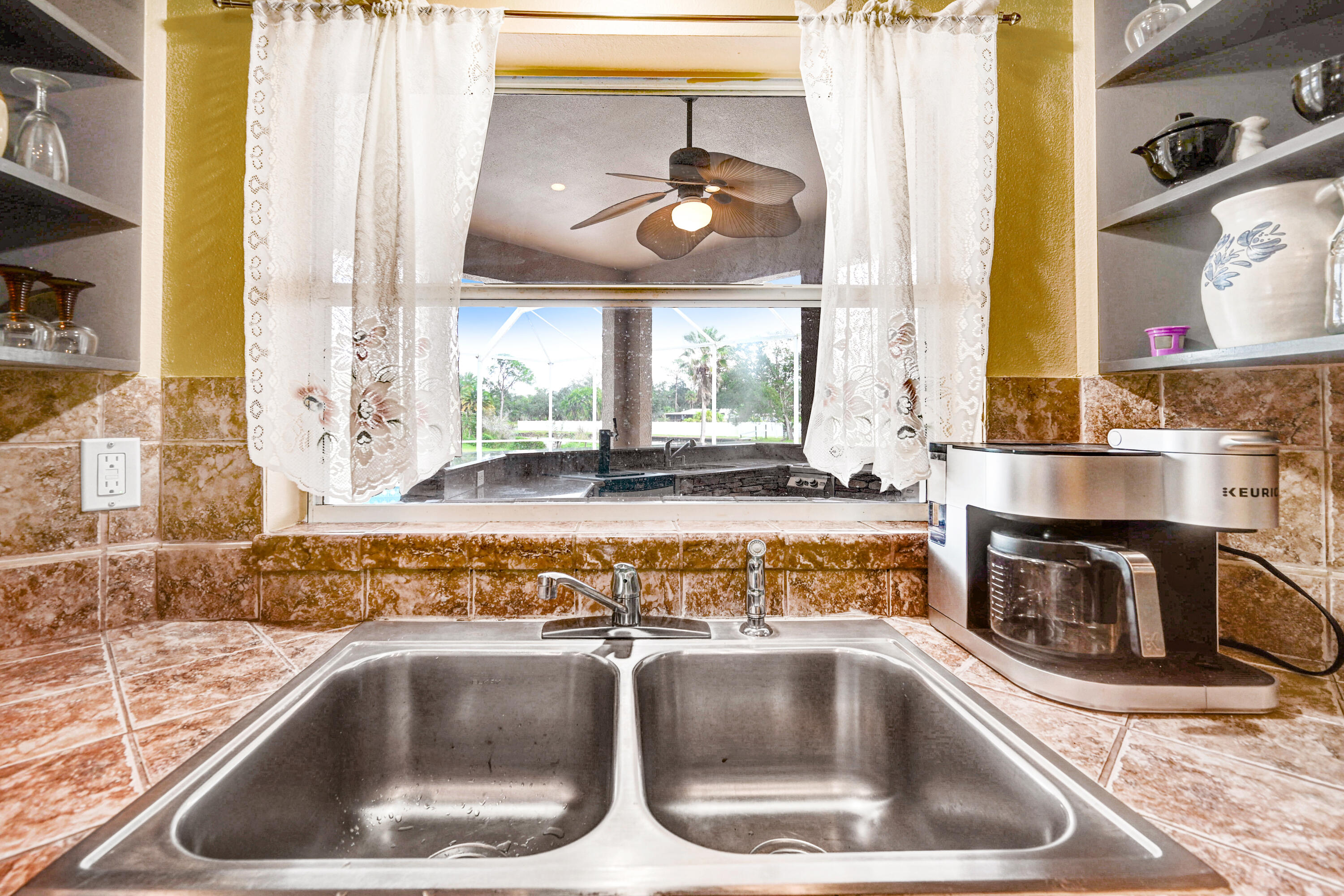4600 James Road Cocoa, FL 32926 - Photo 23 of 56 a view of a kitchen counter top a sink and dishwasher