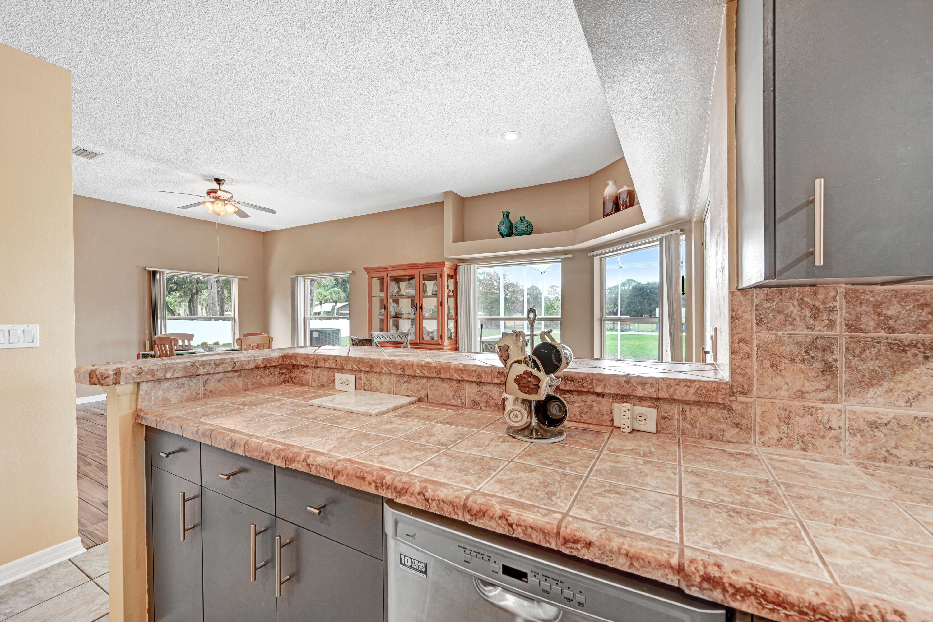 4600 James Road Cocoa, FL 32926 - Photo 24 of 56 a kitchen with granite countertop a sink and a window