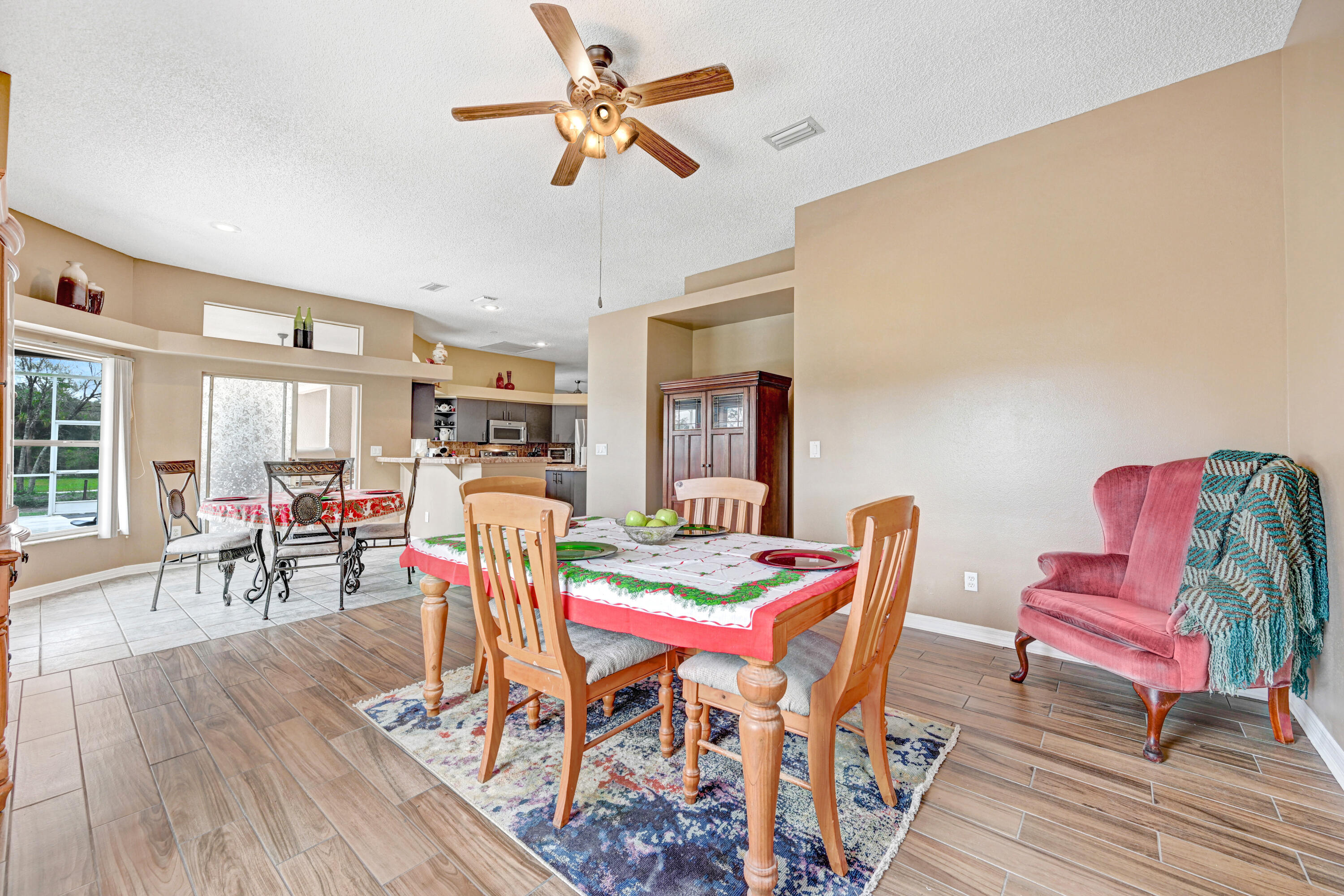 4600 James Road Cocoa, FL 32926 - Photo 28 of 56 a dining room with furniture a rug and wooden floor