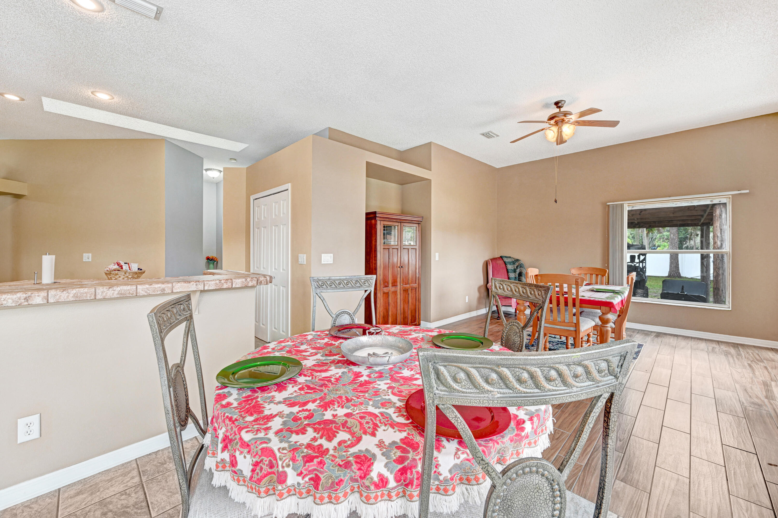 4600 James Road Cocoa, FL 32926 - Photo 29 of 56 a bedroom with a bed and a chandelier