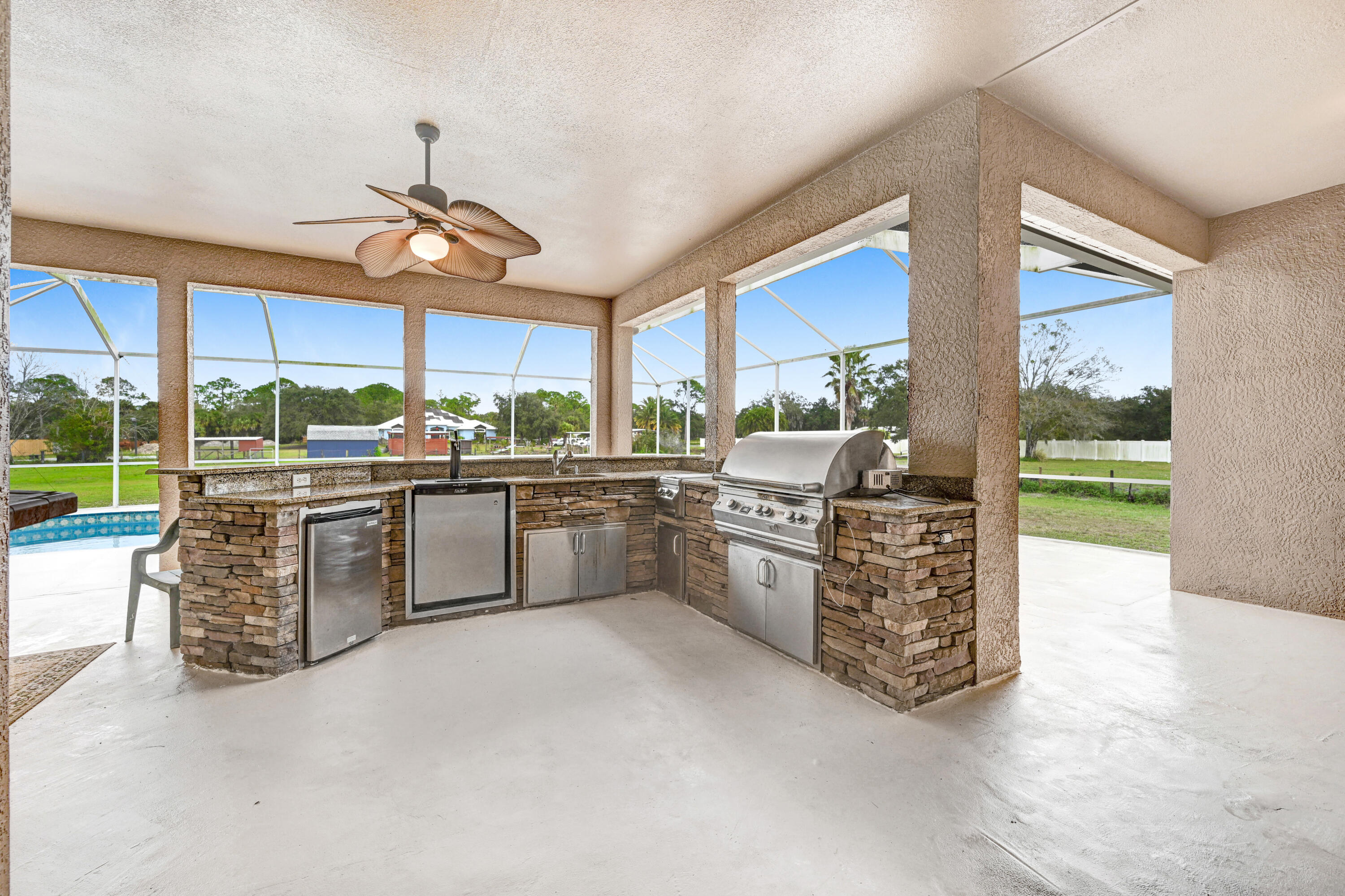 4600 James Road Cocoa, FL 32926 - Photo 34 of 56 a kitchen with a stove a sink and a refrigerator