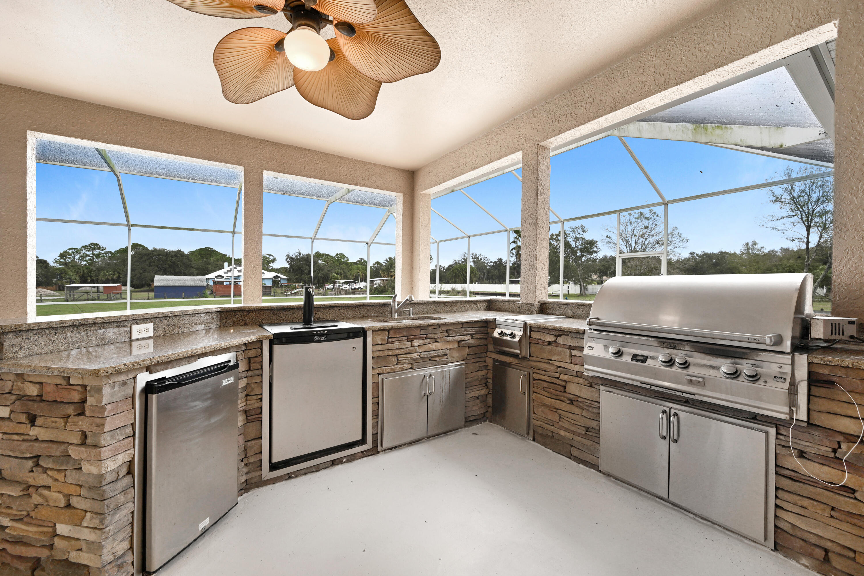 4600 James Road Cocoa, FL 32926 - Photo 35 of 56 a kitchen with a stove cabinets and window