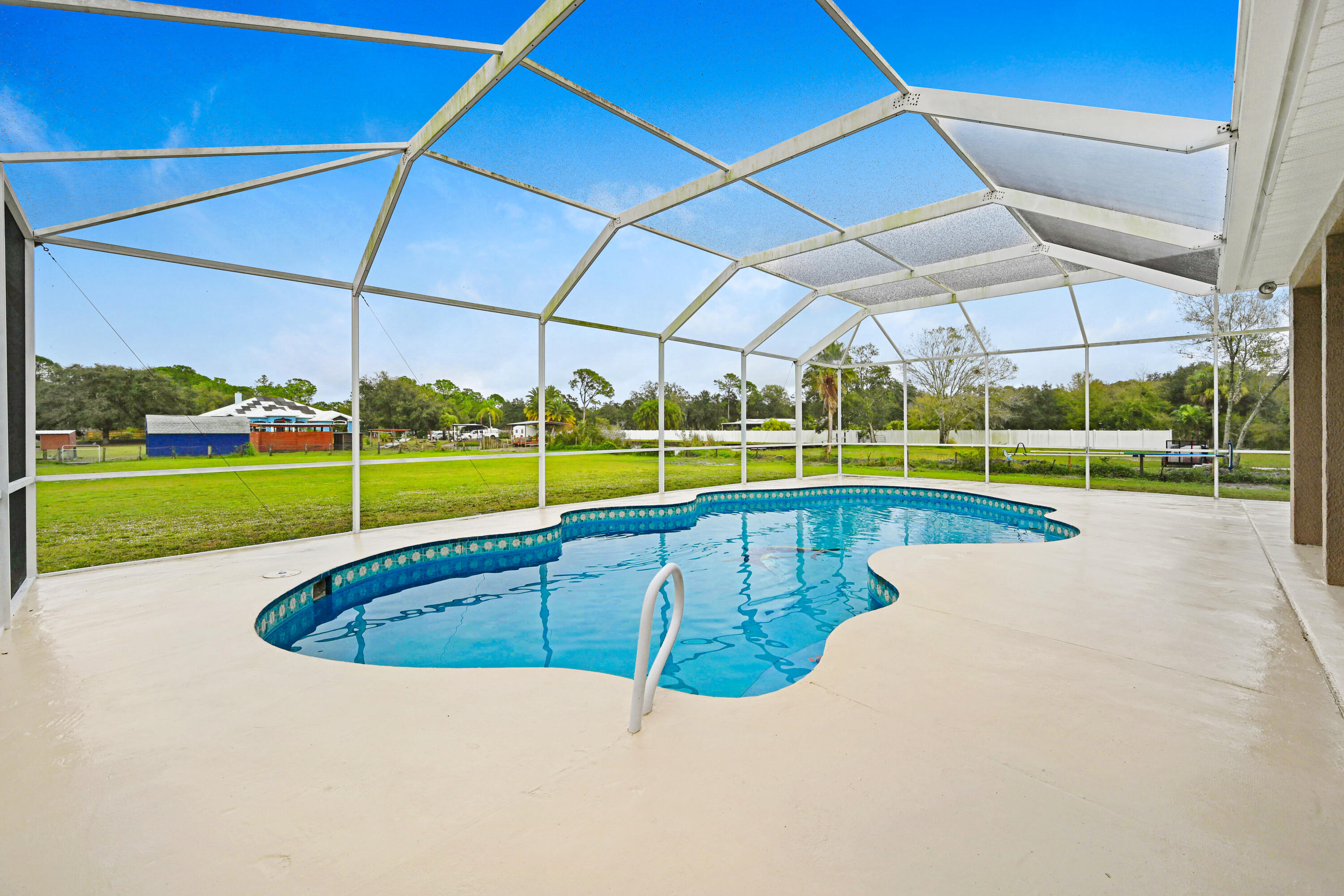 4600 James Road Cocoa, FL 32926 - Photo 42 of 56 a view of a swimming pool with a yard