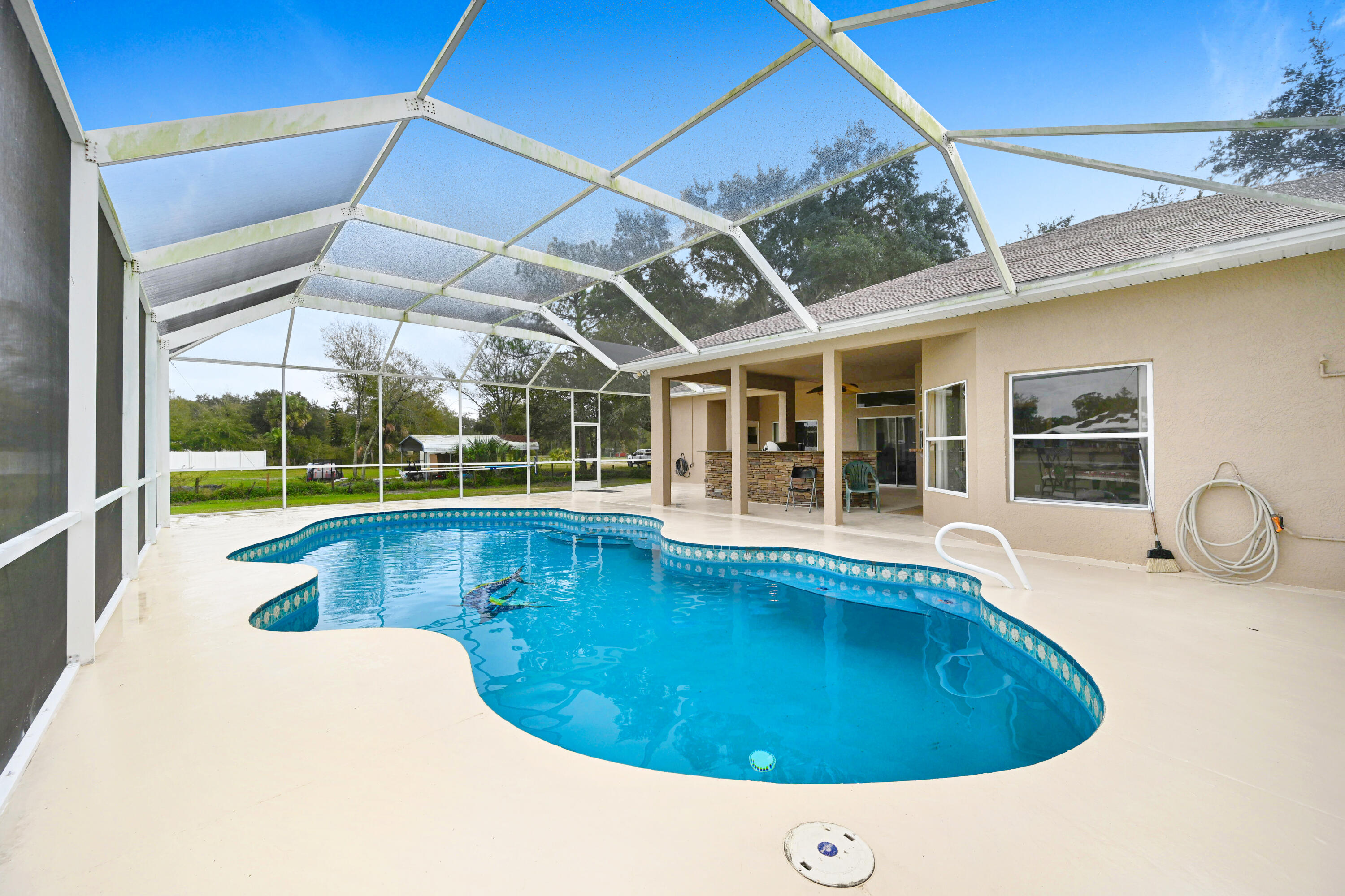 4600 James Road Cocoa, FL 32926 - Photo 43 of 56 a view of a swimming pool with a lounge chair