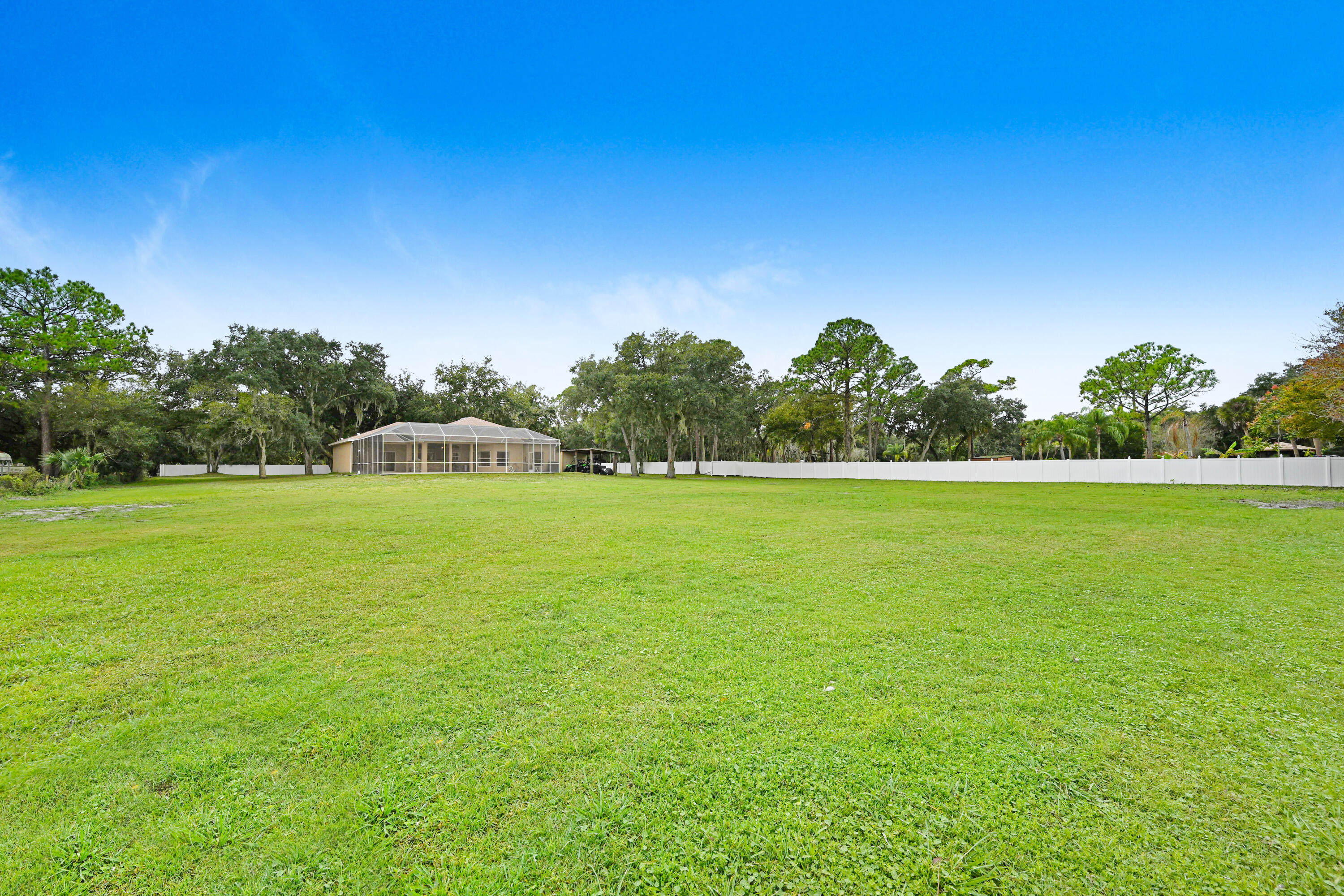 4600 James Road Cocoa, FL 32926 - Photo 46 of 56 a view of a green field with wooden fence