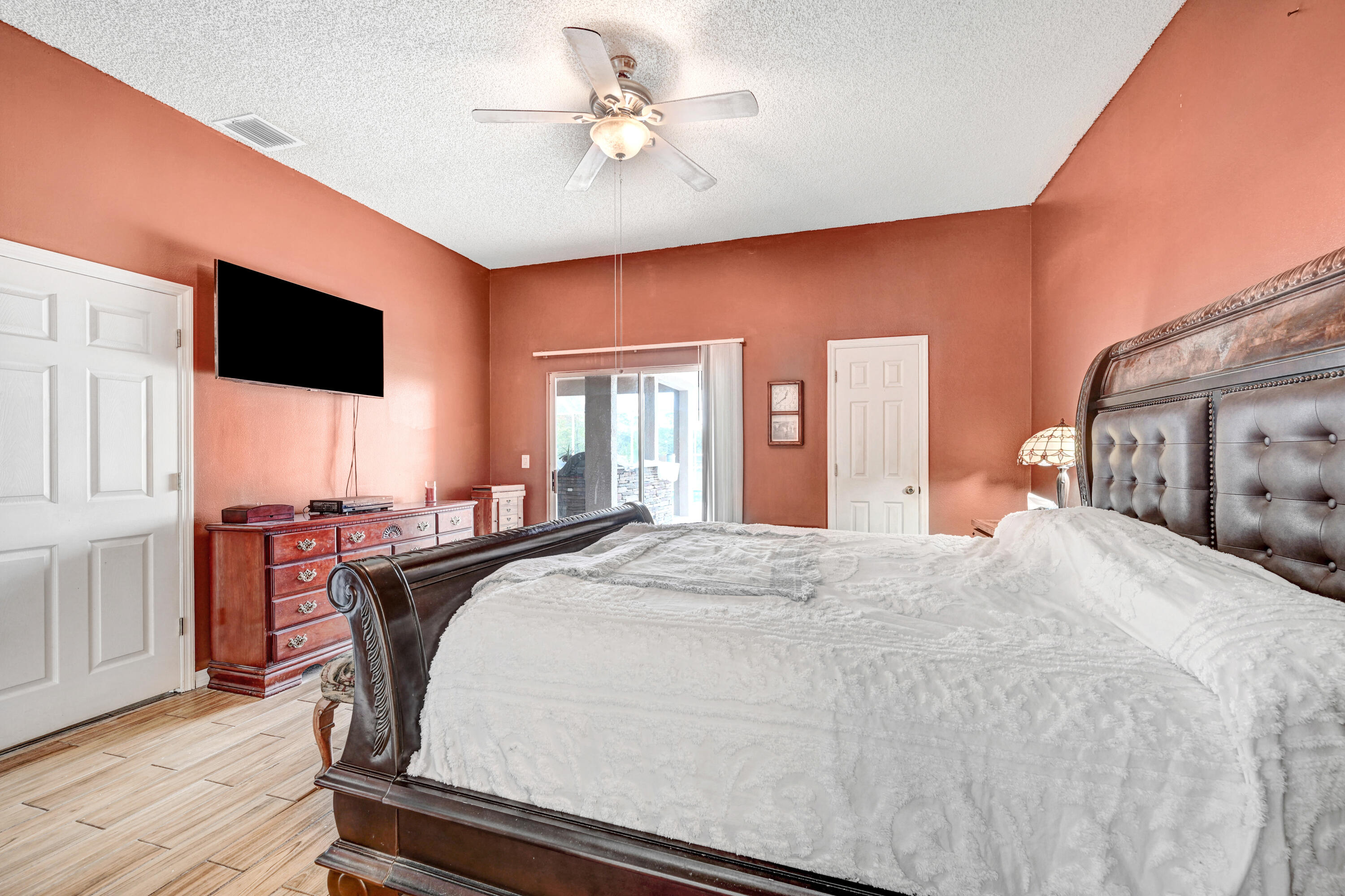 4600 James Road Cocoa, FL 32926 - Photo 10 of 56 a bedroom with a bed and a flat screen tv