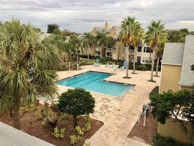 a view of a swimming pool with a patio