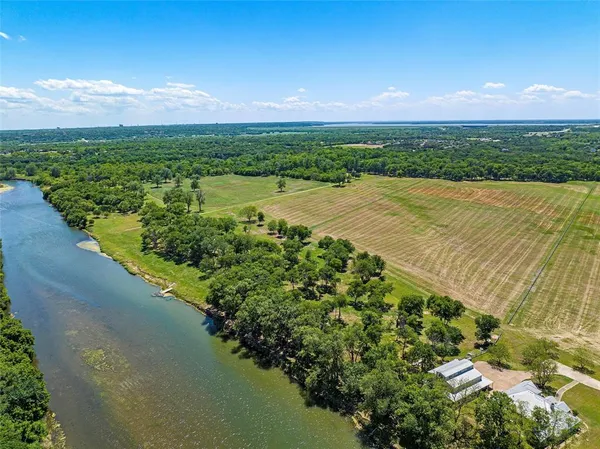 a view of a golf course with a lake view