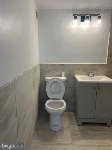 a bathroom with a bathtub a sink a vanity and a shower