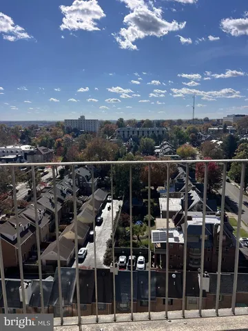 a view of balcony with two chairs and wooden floor