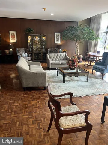 a living room with patio furniture and a fireplace