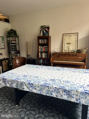 a room with a bed and a dresser