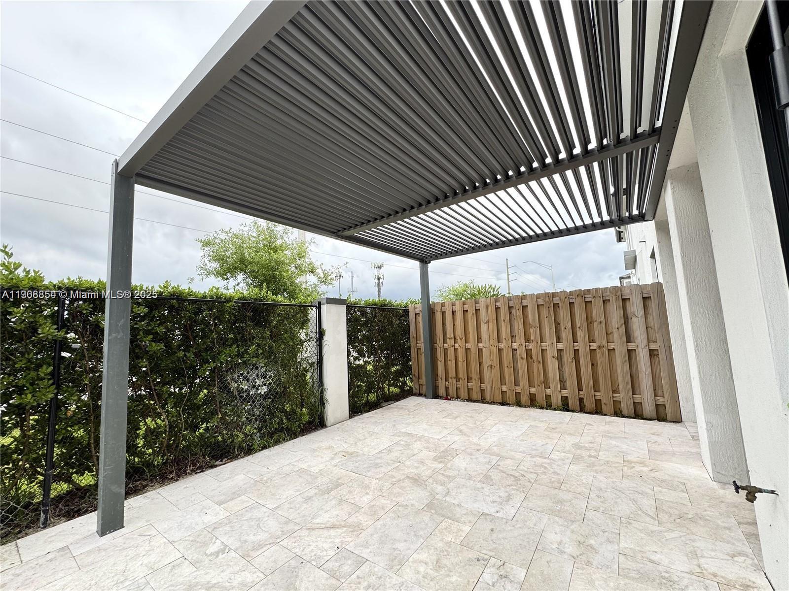 13627 Southwest 157th Court Miami, FL 33196 - Photo 12 of 26 a view of a porch