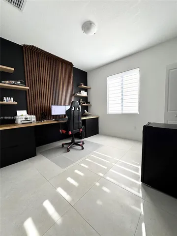 a large white bed in a white room