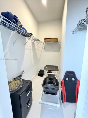 a bedroom with a bed and a tv