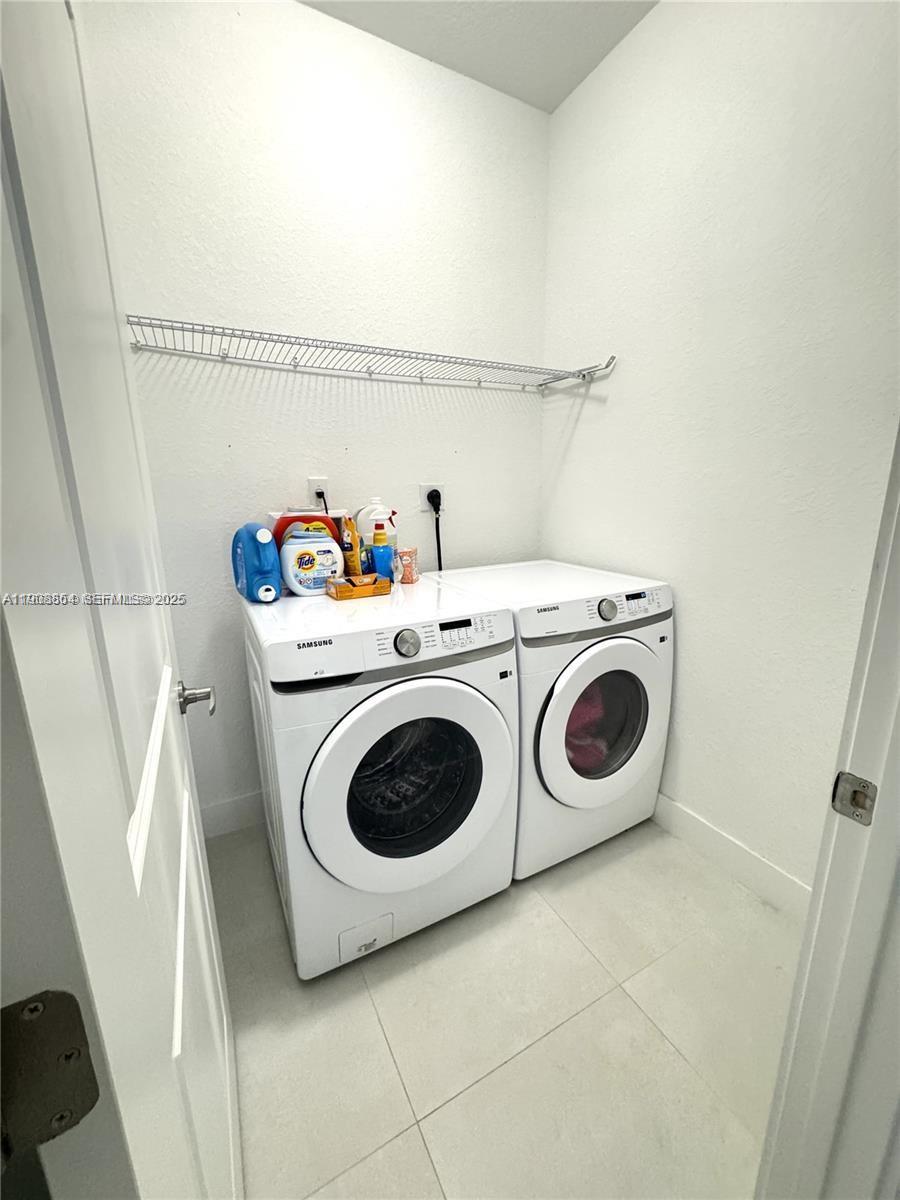 13627 Southwest 157th Court Miami, FL 33196 - Photo 26 of 26 a utility room with dryer and washer