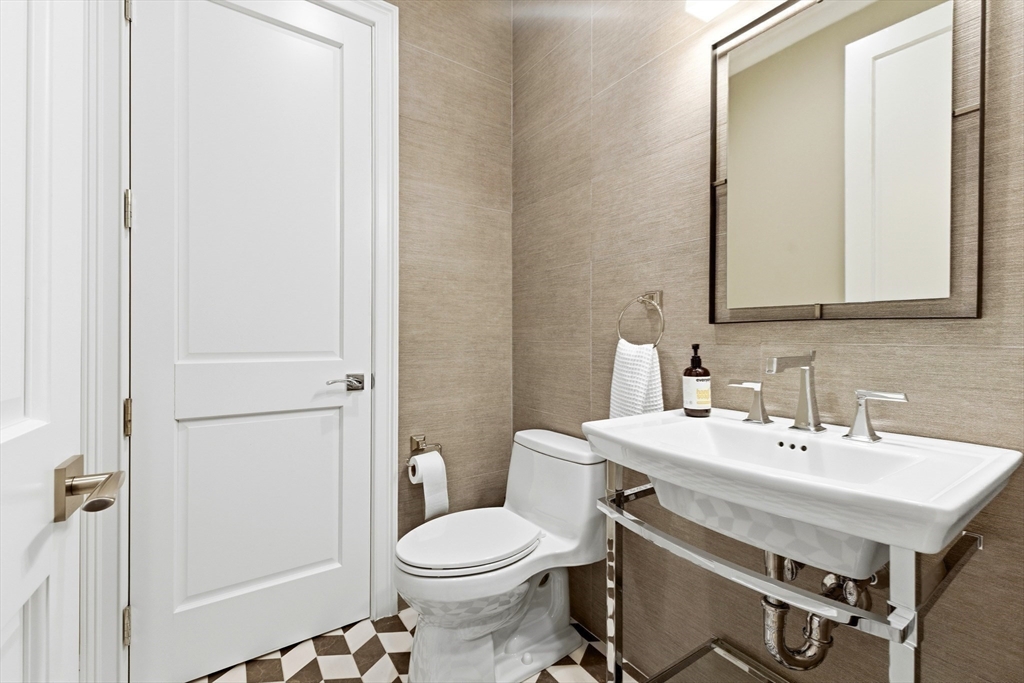 131 St Botolph Street, Unit 1 Boston, MA 02115 - Photo 11 of 29 a bathroom with a sink a toilet and shower