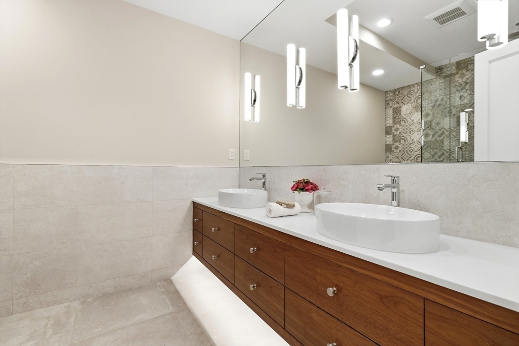 131 St Botolph Street, Unit 1 Boston, MA 02115 - Photo 19 of 29 a bathroom with a sink and a mirror