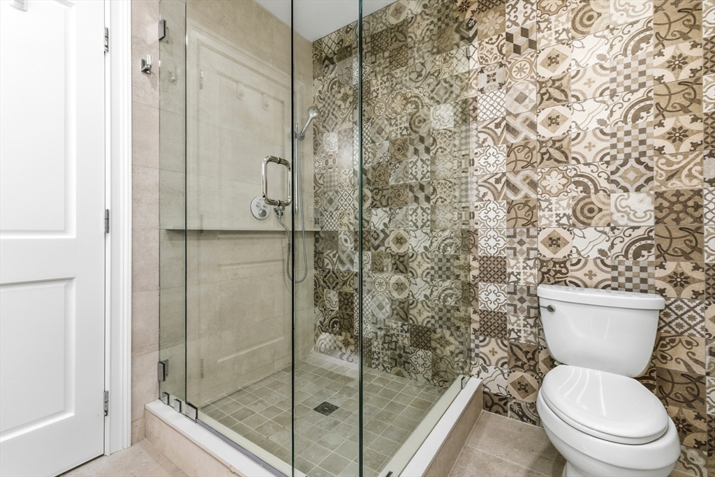 131 St Botolph Street, Unit 1 Boston, MA 02115 - Photo 20 of 29 a white toilet next to a bathroom