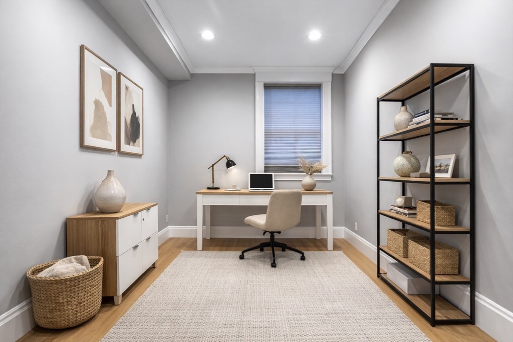 131 St Botolph Street, Unit 1 Boston, MA 02115 - Photo 23 of 29 a living room with furniture and a painting on the wall