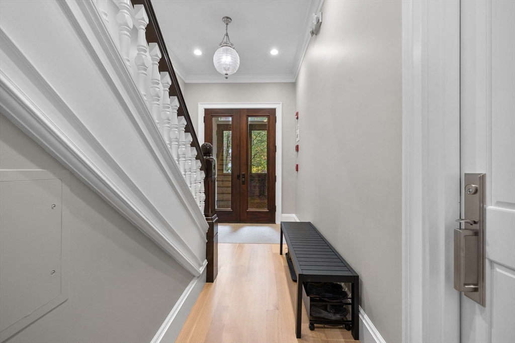 131 St Botolph Street, Unit 1 Boston, MA 02115 - Photo 24 of 29 a view of a hallway with wooden floor and staircase