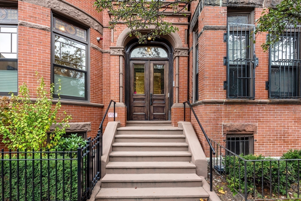 131 St Botolph Street, Unit 1 Boston, MA 02115 - Photo 25 of 29 a view of a brick house with large windows