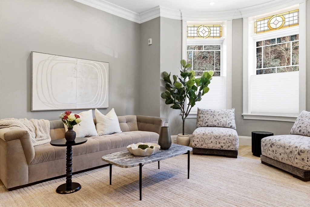 131 St Botolph Street, Unit 1 Boston, MA 02115 - Photo 3 of 29 a living room with furniture and a potted plant