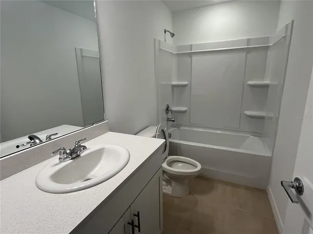 a bathroom with a sink a toilet and a bathtub