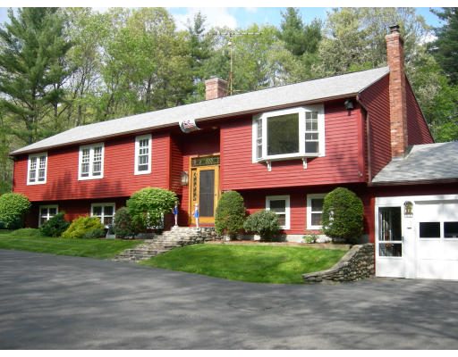 541 Reservoir Road Lunenburg, MA 01462 - Photo 1 of 24 a front view of a house with a yard