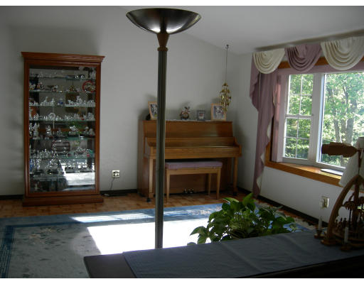 541 Reservoir Road Lunenburg, MA 01462 - Photo 11 of 24 a room with furniture and a window